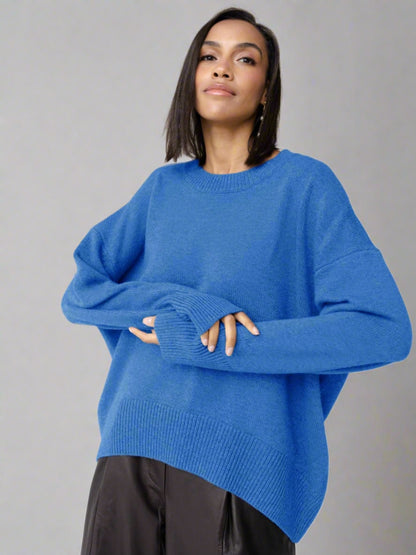 Woman wearing a blue oversized cashmere sweater.