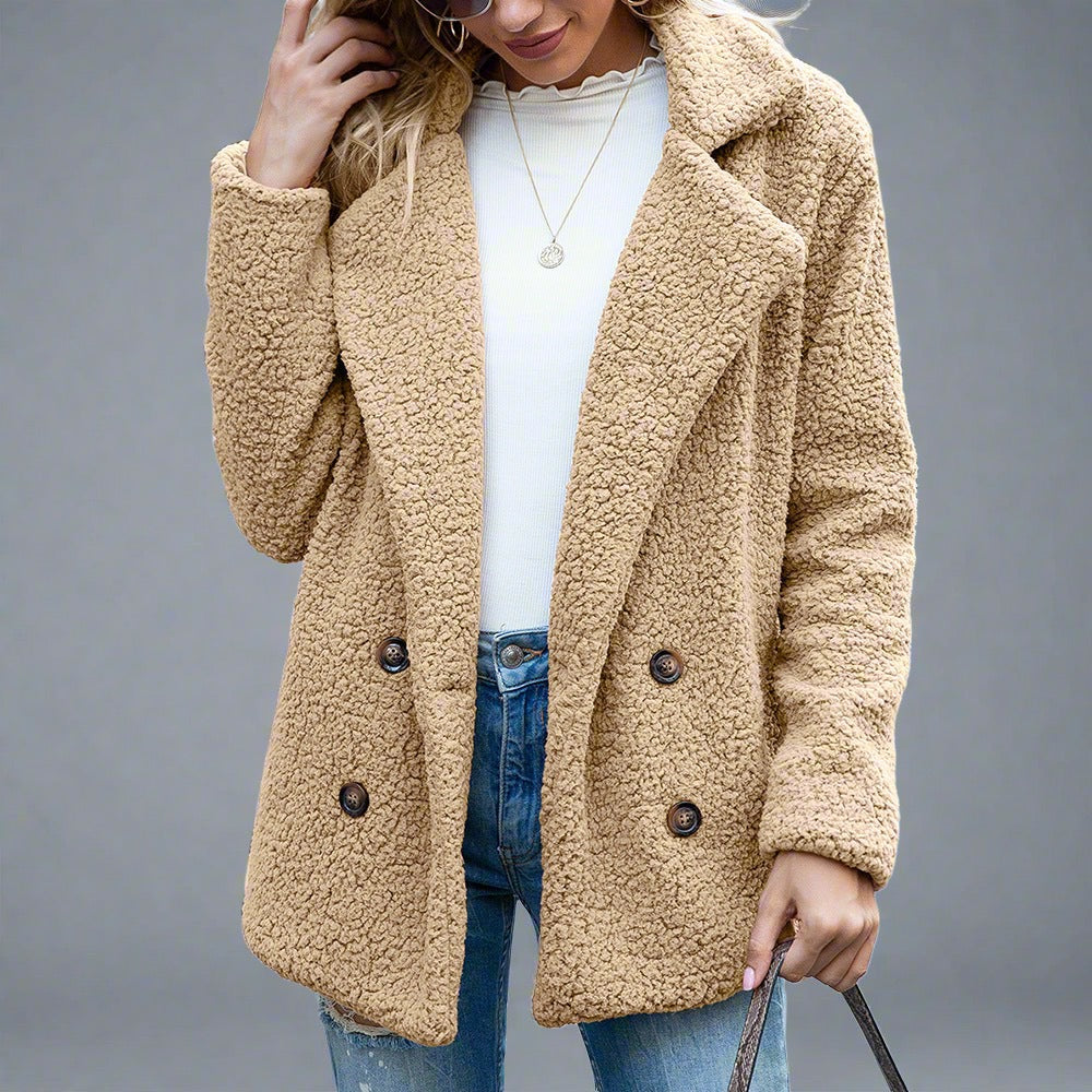 Woman wearing a Cozy Sherpa Fleece Jacket in cream, featuring a double-breasted front with large buttons, paired with jeans and a white top.