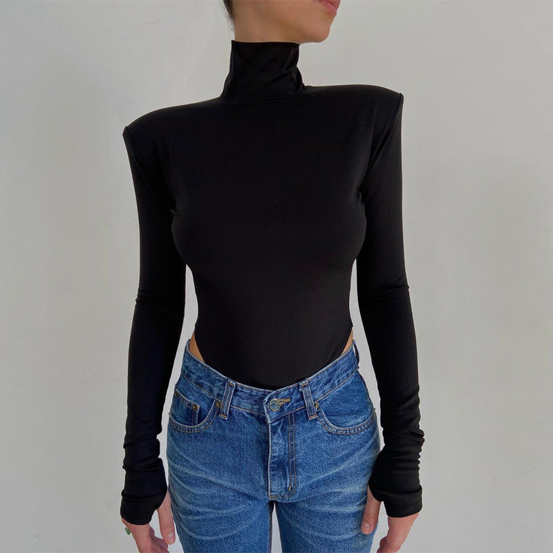 Model wearing the Bold Allure Open-Back Long Sleeve Bodysuit in black ideal for stylish travel outfits