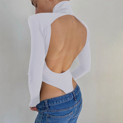 Model wearing the Bold Allure Open-Back Long Sleeve Bodysuit in white, ideal for stylish travel outfits