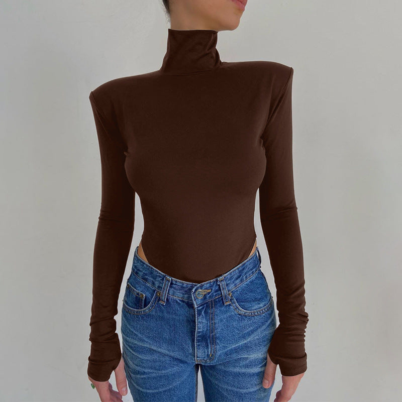 Model wearing the Bold Allure Open-Back Long Sleeve Bodysuit in brown, ideal for stylish travel outfits