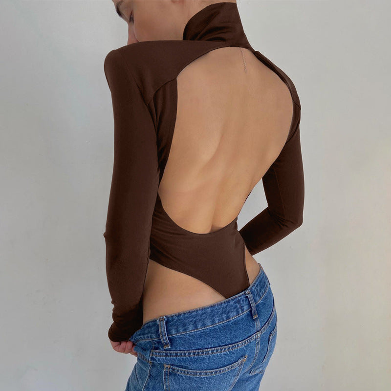 Model wearing the Bold Allure Open-Back Long Sleeve Bodysuit in brown, ideal for stylish travel outfits