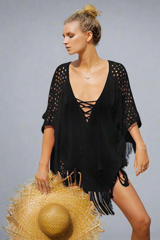 Woman wearing a black fringe beach cover-up.