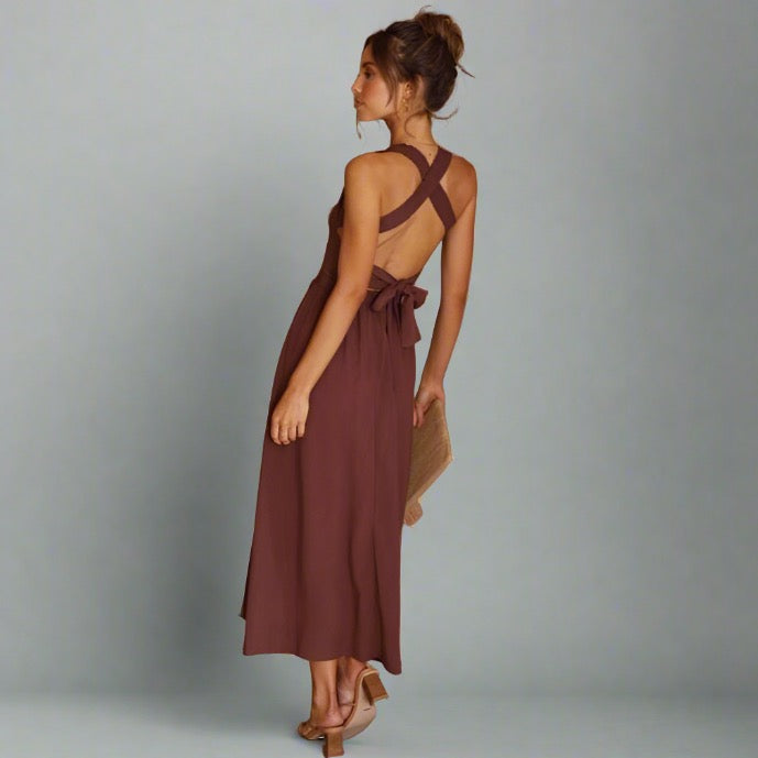 Woman wearing an elegant back-tie midi dress in brown.