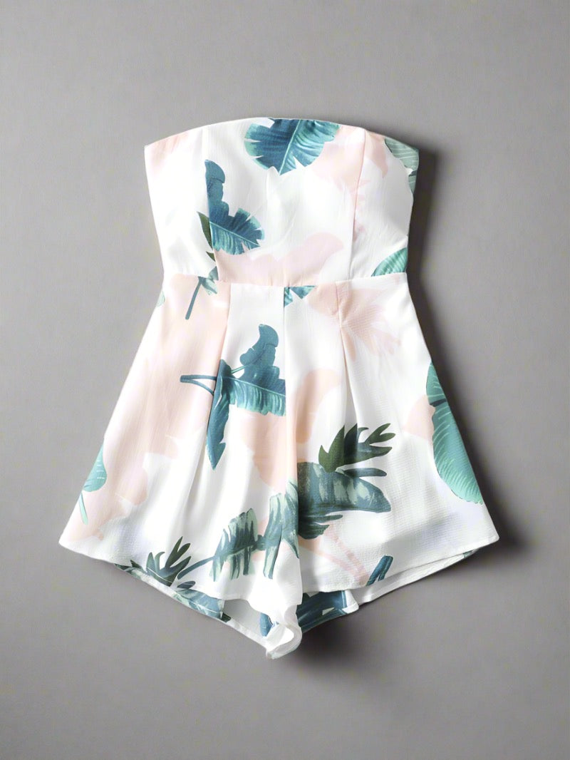 Tropical Paradise Strapless Romper in vibrant leaf print, available in two colors, perfect for travelers.