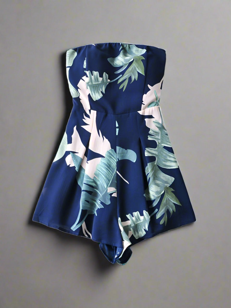 Tropical Paradise Strapless Romper in vibrant leaf print, available in two colors, perfect for travelers.