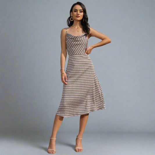 Woman wearing a Geometric Pattern Midi Dress with adjustable spaghetti straps.