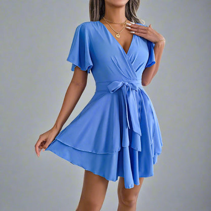 Elegant Explorer Wrap Dress - blue wrap dress with V-neckline, flutter sleeves, adjustable waist tie, and flowy skirt, perfect for city explorations, resort dinners, beach strolls, and casual outings.