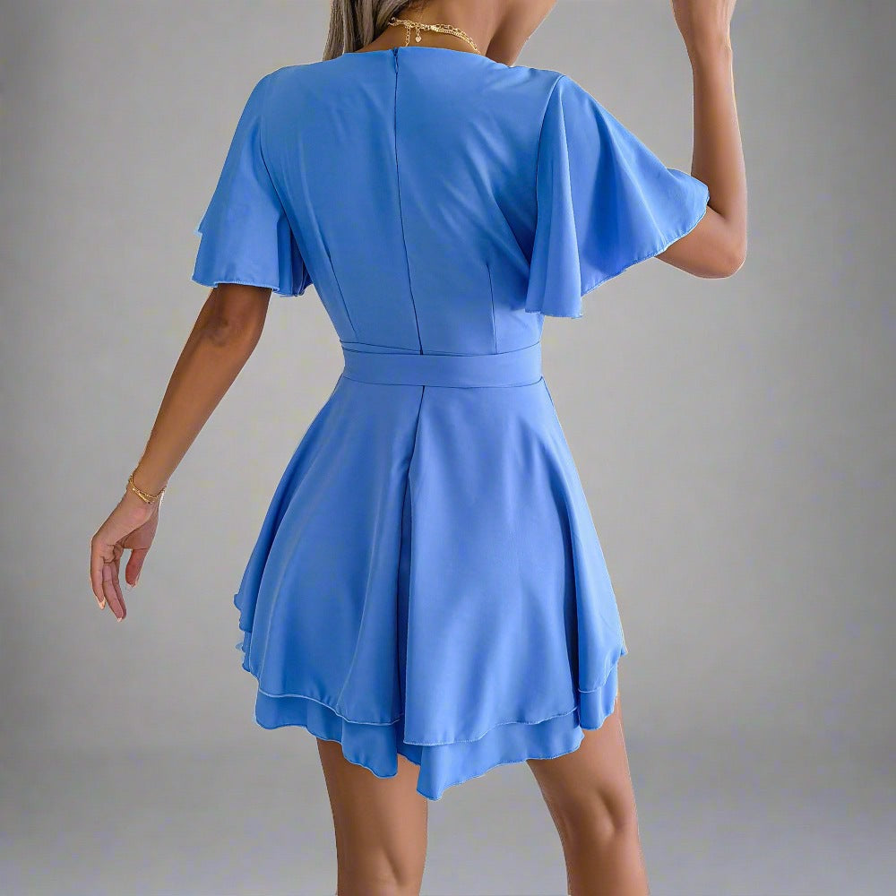 Elegant Explorer Wrap Dress - blue wrap dress with V-neckline, flutter sleeves, adjustable waist tie, and flowy skirt, perfect for city explorations, resort dinners, beach strolls, and casual outings.