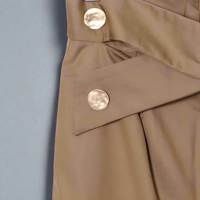 High-waisted khaki pants with button detailing.