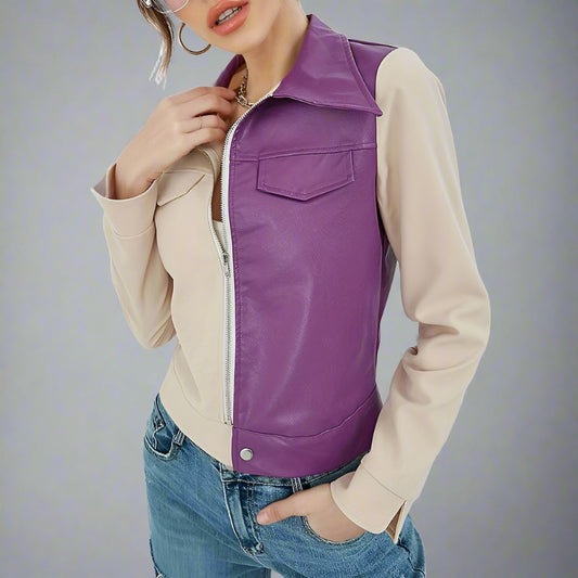 Woman wearing a Color-Block Leather and Fabric Jacket with a purple leather front and beige fabric sleeves and back, featuring a zip-up front and snap-button details.