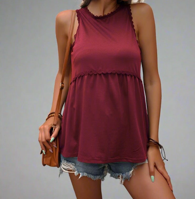 Woman wearing Casual Chic Summer Lace Tank Top in red, paired with denim shorts and a crossbody bag