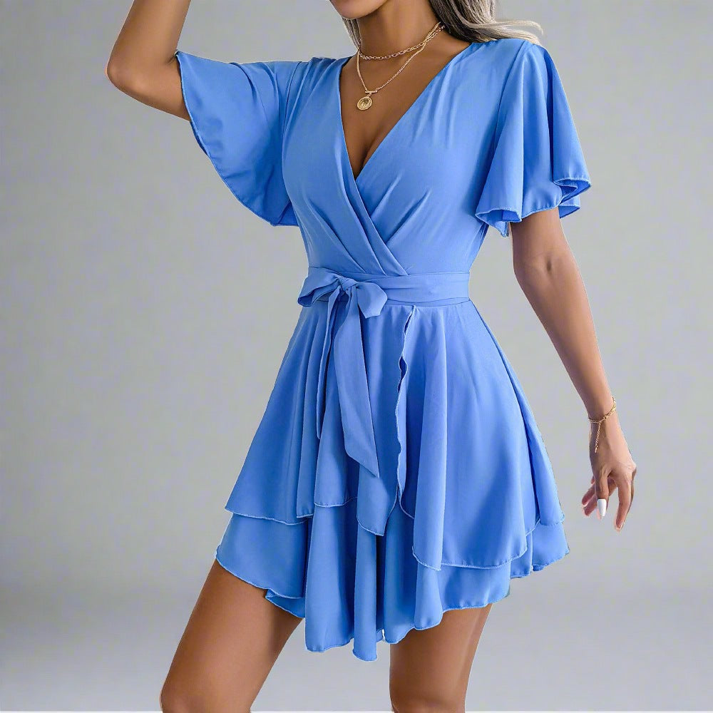 Elegant Explorer Wrap Dress - blue wrap dress with V-neckline, flutter sleeves, adjustable waist tie, and flowy skirt, perfect for city explorations, resort dinners, beach strolls, and casual outings.