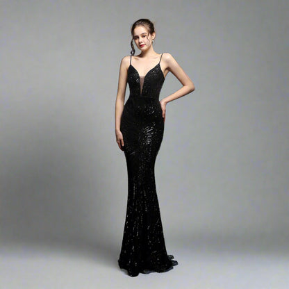 Model wearing Luxury Traveler's Sequin Gala Gown in black, featuring a body-hugging silhouette with intricate sequin details and spaghetti straps