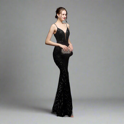 Model wearing Luxury Traveler's Sequin Gala Gown in black, featuring a body-hugging silhouette with intricate sequin details and spaghetti straps