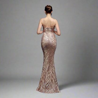 Model wearing Luxury Traveler's Sequin Gala Gown in gold, featuring a body-hugging silhouette with intricate sequin details and spaghetti straps